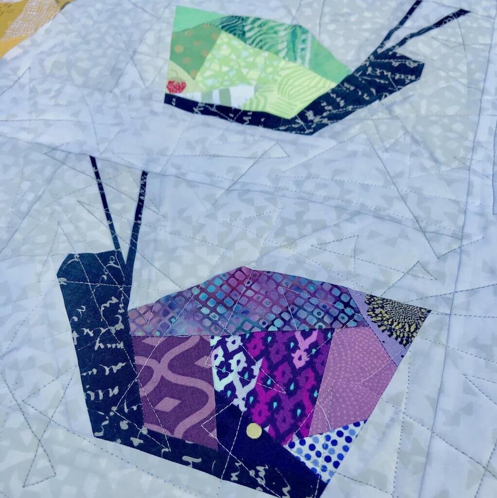 snail quilt using Modern Quilt Guild logo colors