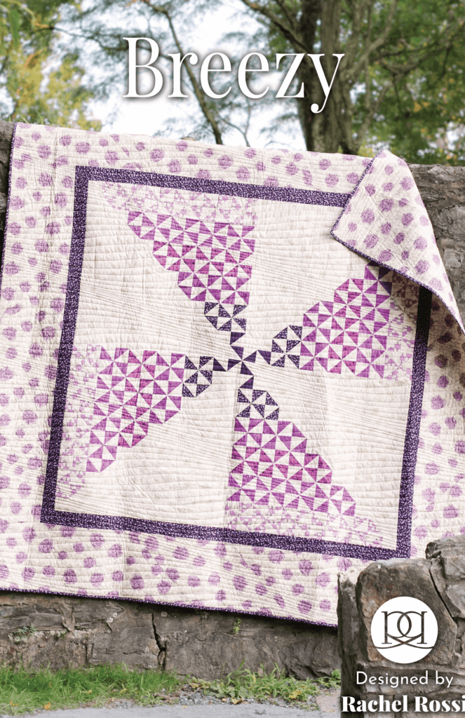 Pattern cover page for the Breezy pinwheel quilt pattern. The quilt is a pinwheel shape using half-square triangles (HSTs). The image on the cover is a large, square king-size quilt using purple fabrics, and the quilt is hung on a stone wall.